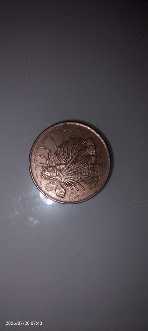 Singapore 50 Cents Coin (Category: Currency) located in Caloocan City. Submitted by carylpangi13052 (Listing ID 1450735672, Image 2). Description: - Singapore 50 cents coin - Year: 1968 - Features a lionfish design - Inscription: '50 CENTS SINGAPORE' - Ideal for coin collectors and numismatists.