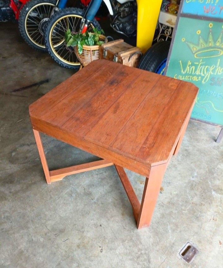 Solid Wood Side Table / Coffee Table (Category: Tables & Sets) located in Shah Alam. Submitted by jamie9collector (Listing ID 1450733043, Image 1). Description: - Mid Century Modern Teak Coffee Table - Warm, inviting wood tone - Versatile: use as a coffee table or side table - Sturdy construction with cross leg support - Approximate height: 22 inches - Surface shows minor wear consistent with normal use - Ready for its new home!.