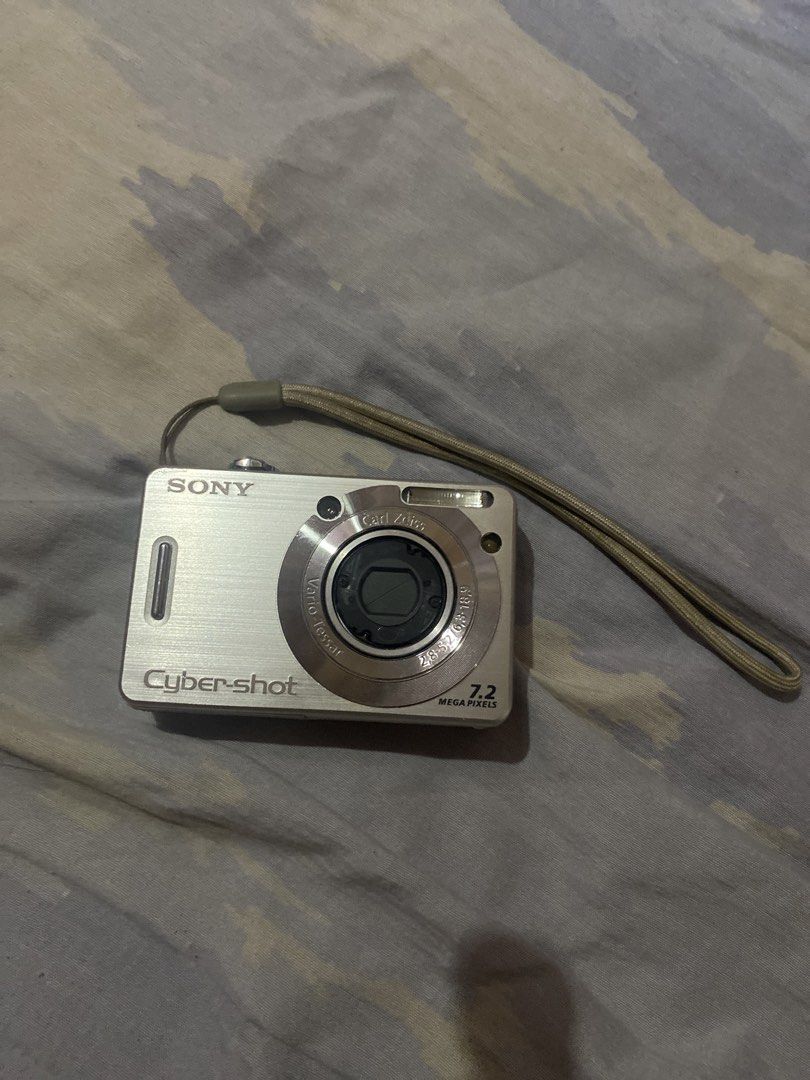 Sony Cyber-shot 7.2 MP Digital Camera (Category: Cameras) located in Manila. Submitted by _andireya (Listing ID 1450530829, Image 1). Description: - Silver Sony Cyber-shot digital camera - 7.2 Megapixels - Comes with wrist strap - Ideal for casual photography - UNIT ONLY - NOT GUARANTEE TO WORK.