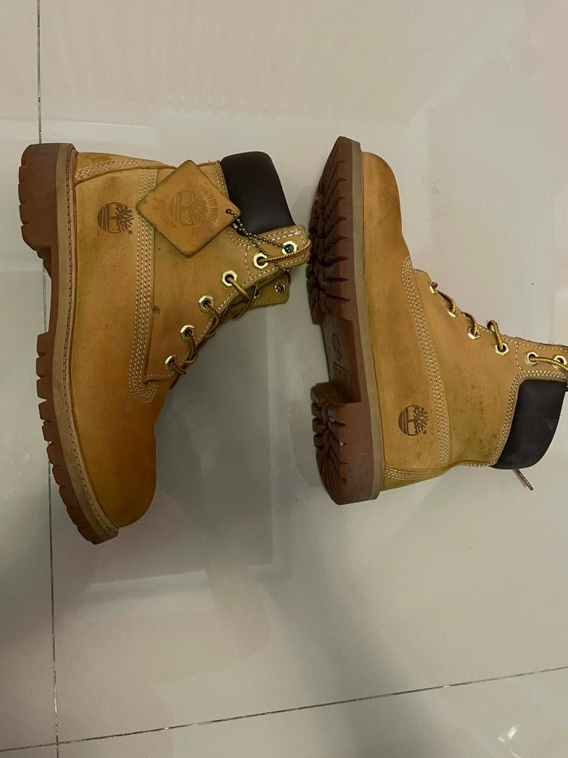 Timberland Classic Premium Waterproof Boots JUNIOR SIZE 4 (Category: Boots) located in Taguig. Submitted by delski101 (Listing ID 1450669294, Image 2). Description: Authentic Timberland Junior Waterproof Boots in the classic Tan colorway. Selling a pair of genuine Timberland Junior Boots, size 4. Built for comfort, durability, and everyday wear. They're perfect for school, outdoor adventures, or casual outfits. The boots are in good used conditio