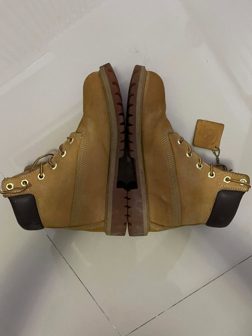 Timberland Classic Premium Waterproof Boots JUNIOR SIZE 4 (Category: Boots) located in Taguig. Submitted by delski101 (Listing ID 1450669294, Image 3). Description: Authentic Timberland Junior Waterproof Boots in the classic Tan colorway. Selling a pair of genuine Timberland Junior Boots, size 4. Built for comfort, durability, and everyday wear. They're perfect for school, outdoor adventures, or casual outfits. The boots are in good used conditio