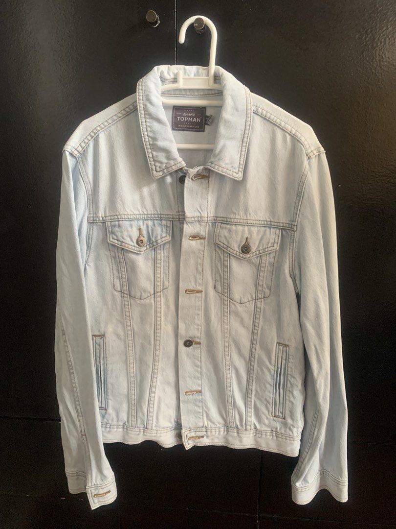 Topman Light Wash Denim Jacket (Category: Coats, Jackets and Outerwear) located in Makati City. Submitted by ed_______ (Listing ID 1450687187, Image 1). Description: - Classic light wash denim jacket - Brand: Topman - Button-up front closure - Two chest pockets - Standard collar - Ideal for layering or wearing on its own - Versatile piece for casual outfits.
