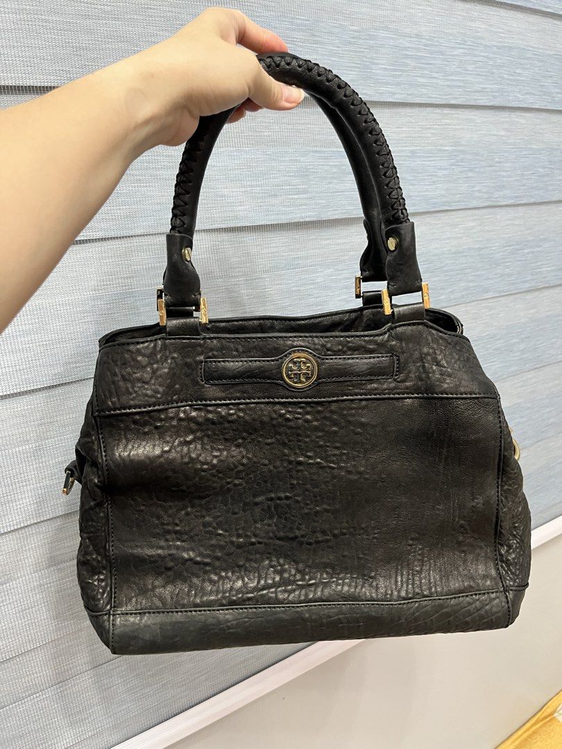 Tory Burch Black Leather Tote Bag (Category: Luxury Bags & Wallets) located in Bulacan. Submitted by spring_cleaning_ (Listing ID 1450702425, Image 1). Description: - Authentic Tory Burch black leather tote bag - Textured leather exterior with elegant braided handles - Chic gold hardware details - Multiple interior compartments for organization - Secure zip pocket inside - Includes a detachable strap for versatile carrying options - Ample space f