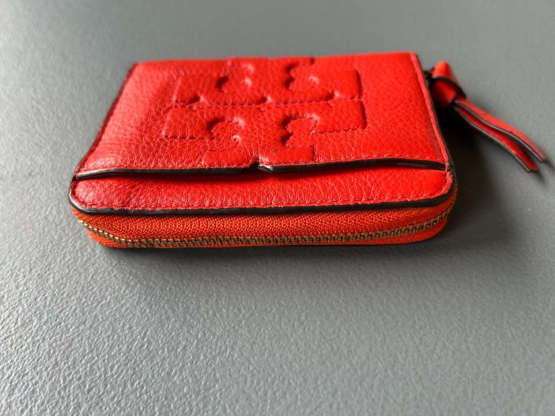 Tory Burch Red Leather Coin Pouch Wallet (Category: Luxury Bags & Wallets) located in Calamba. Submitted by merrymerida (Listing ID 1450597454, Image 3). Description: - Bright red Tory Burch coin pouch - Genuine leather with embossed logo - Secure zipper closure - Interior card slots for organization - Cute tassel detail on zipper pull - Ideal for keeping small essentials tidy.