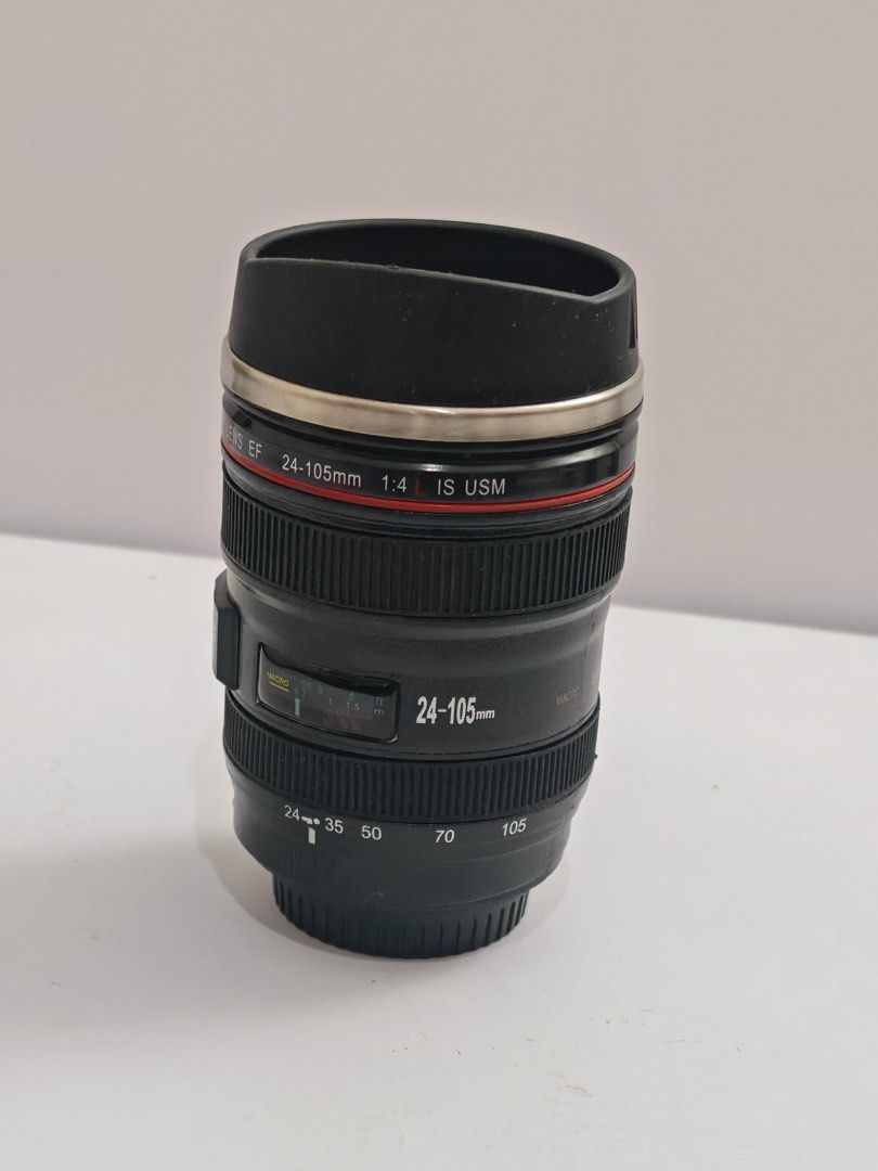 Universal Studios Canon EF 24-105mm Lens Mug (Category: Coffee & Tea Tableware) located in Quezon City. Submitted by krismocha (Listing ID 1450697366, Image 1). Description: - Novelty mug designed like a Canon EF 24-105mm f/4L IS USM lens - Features a durable stainless steel interior - Includes a convenient black lid - Ideal gift for photographers and camera enthusiasts - Unique and fun conversation starter - Original price tag from Universal Stu