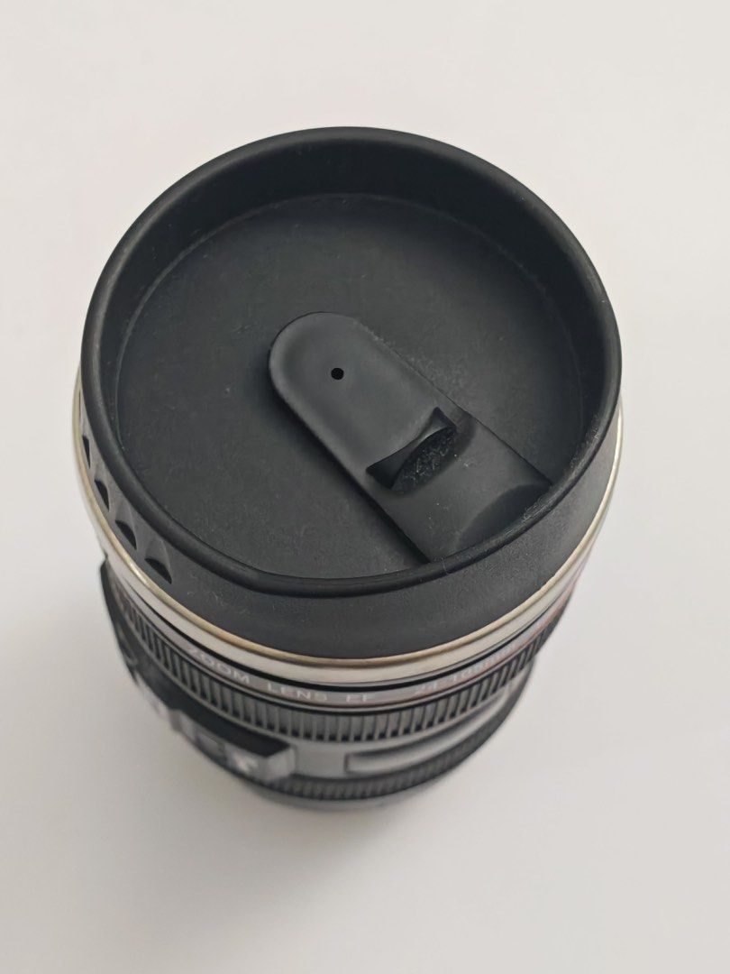 Universal Studios Canon EF 24-105mm Lens Mug (Category: Coffee & Tea Tableware) located in Quezon City. Submitted by krismocha (Listing ID 1450697366, Image 3). Description: - Novelty mug designed like a Canon EF 24-105mm f/4L IS USM lens - Features a durable stainless steel interior - Includes a convenient black lid - Ideal gift for photographers and camera enthusiasts - Unique and fun conversation starter - Original price tag from Universal Stu