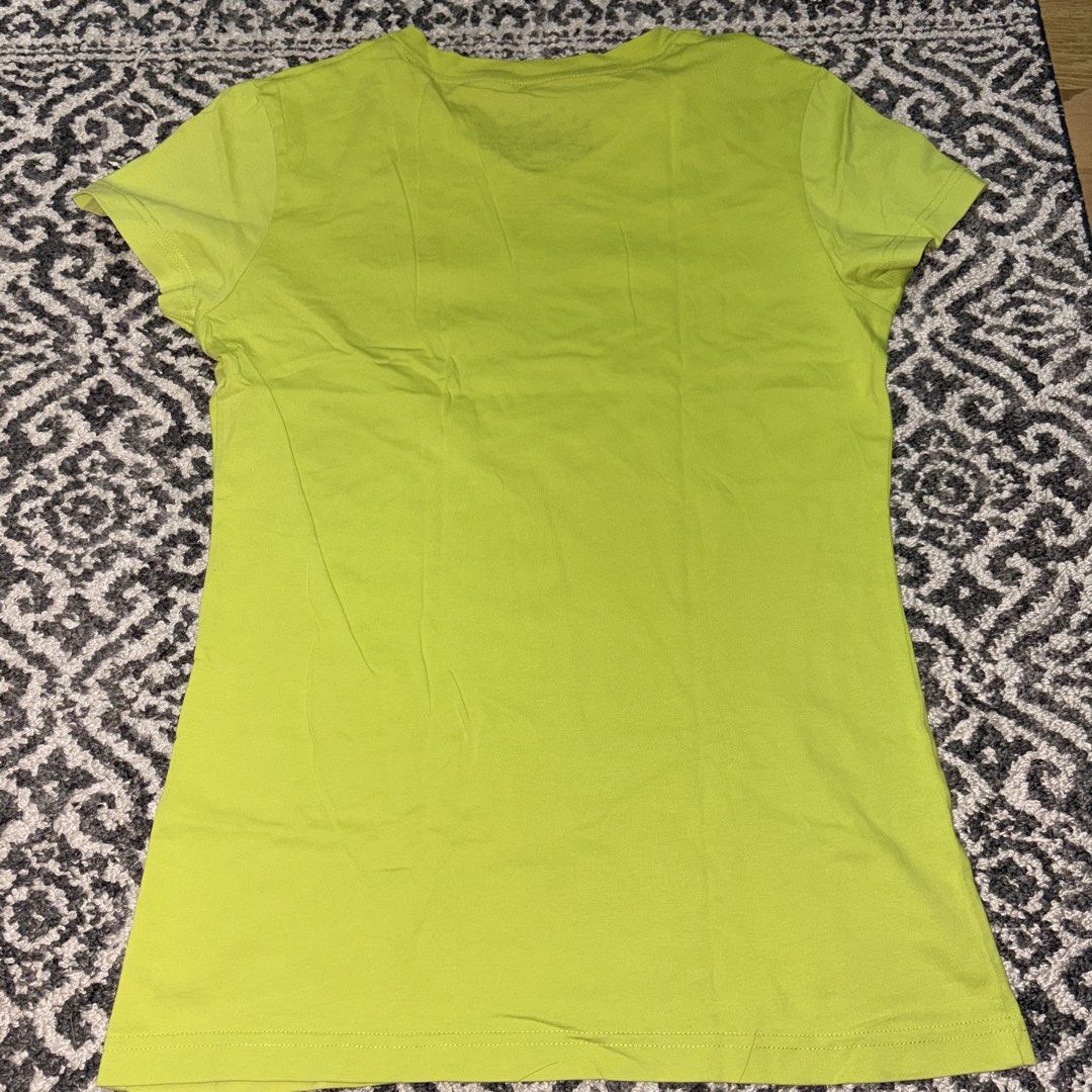 Universal Studios Singapore embroidered green shirt (Category: Shirts) located in Manila. Submitted by danekb (Listing ID 1450709281, Image 3). Description: has small holes (see last pic) size L FLAT MEASUREMENTS: length - approx 26 inches width - approx 16 inches.