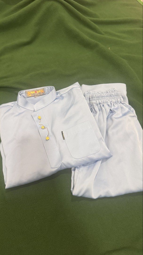 Upin Ipin by Jakel Kids Baju Melayu Set Light Blue Size 4/5 (Category: Babies & Kids Fashion) located in Petaling Jaya. Submitted by jajarahim (Listing ID 1450563789, Image 1). Description: - Light blue Baju Melayu set for kids - Features Upin Ipin characters on the label - Brand: Jakel - Size: 4/5 - Comfortable elastic waistband on pants - Stylish gold buttons on the top - Ideal for Hari Raya and special occasions COD- Kota Damansara All item ex