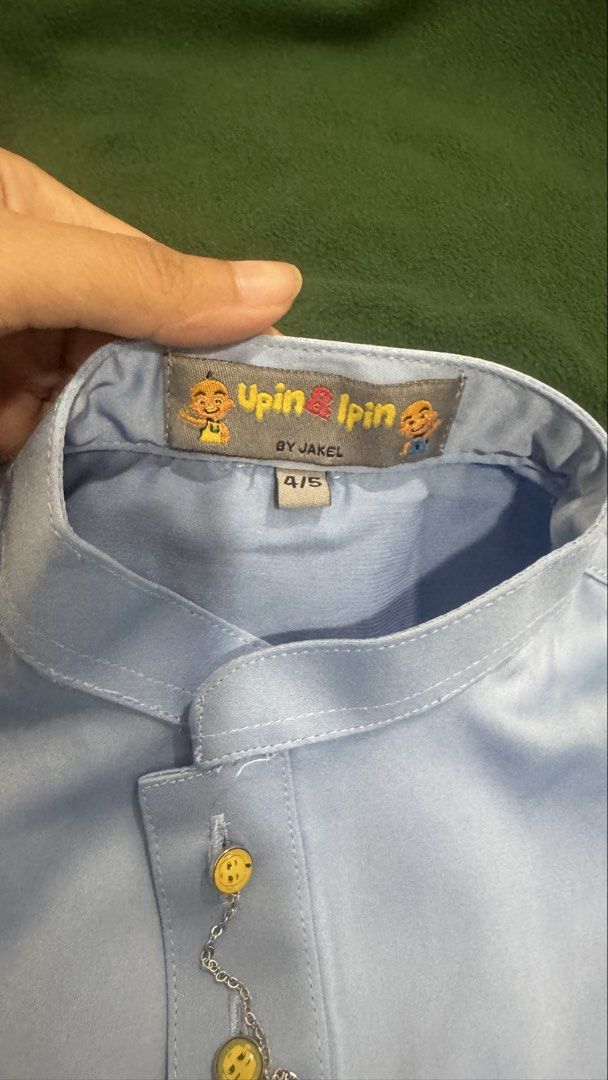 Upin Ipin by Jakel Kids Baju Melayu Set Light Blue Size 4/5 (Category: Babies & Kids Fashion) located in Petaling Jaya. Submitted by jajarahim (Listing ID 1450563789, Image 2). Description: - Light blue Baju Melayu set for kids - Features Upin Ipin characters on the label - Brand: Jakel - Size: 4/5 - Comfortable elastic waistband on pants - Stylish gold buttons on the top - Ideal for Hari Raya and special occasions COD- Kota Damansara All item ex