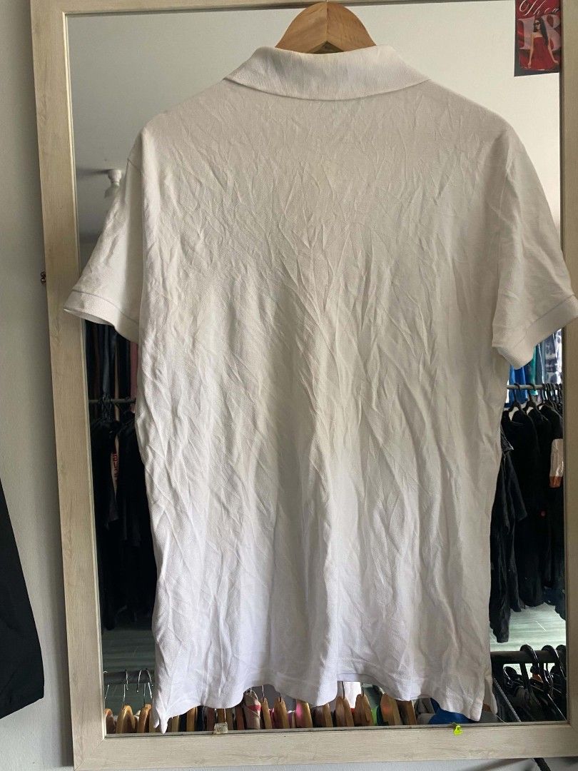 Versace Jeans Couture White Polo Shirt (Category: Tshirts & Polo Shirts ) located in Manila. Submitted by jp-collection (Listing ID 1450543725, Image 2). Description: - White Versace Jeans Couture polo shirt - Short sleeves and classic collar - Features 'Versace Jeans Couture Since 1989' graphic print on the front - Made from comfortable fabric - Ideal for casual wear.