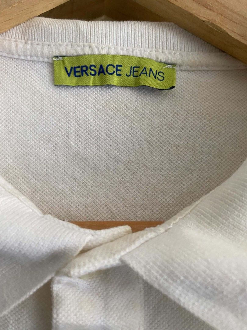 Versace Jeans Couture White Polo Shirt (Category: Tshirts & Polo Shirts ) located in Manila. Submitted by jp-collection (Listing ID 1450543725, Image 3). Description: - White Versace Jeans Couture polo shirt - Short sleeves and classic collar - Features 'Versace Jeans Couture Since 1989' graphic print on the front - Made from comfortable fabric - Ideal for casual wear.