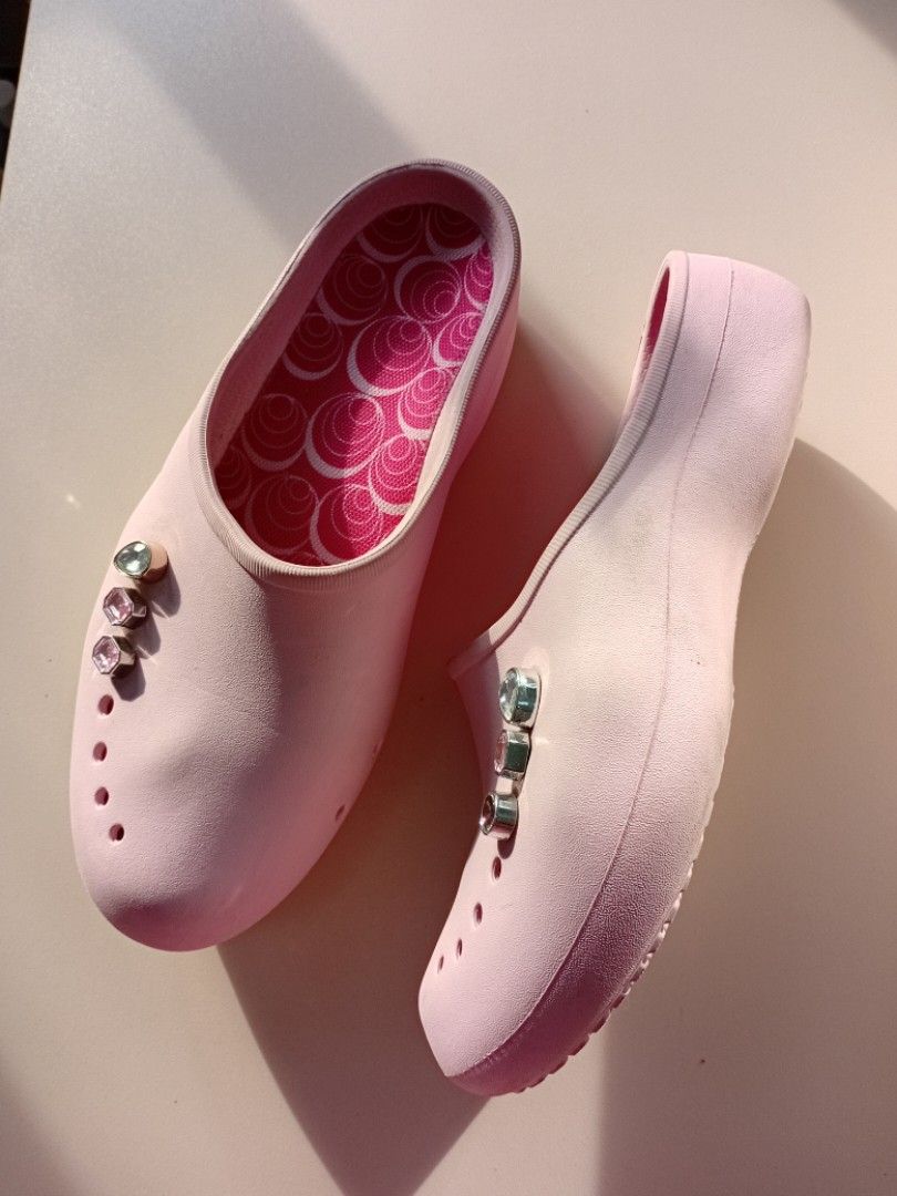 Vintage Crocs Pink Clogs with Charms (Category: Slippers and slides) located in Navotas City. Submitted by ms.soulana (Listing ID 1450655868, Image 2). Description: PreOwned lightly Used Authentic 💯🩷 Pink Crocs Womens clogs wth Jibbitz Womens 9 25 cm - Decorated with cute charms - Fun pink swirl pattern inside - Easy slip-on design - Soles with good grip - Ideal for casual wear or gardening Min Sign of Used No heel drag Good Condition 9/10.