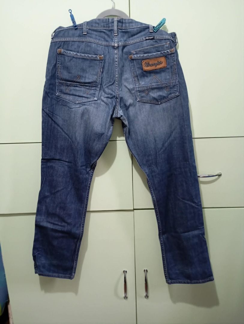 Wrangler Spencer Blue Denim Jeans (Category: Jeans) located in Pasig City. Submitted by ajms63804 (Listing ID 1450553217, Image 3). Description: - Classic blue denim jeans - Brand: Wrangler - Model: Spencer - Waist: 35-36 inches - Closure: Button fly - Pockets: Standard five-pocket design - Fit: Comfortable - Style: Great for casual wear - Condition: Good, no major flaws.