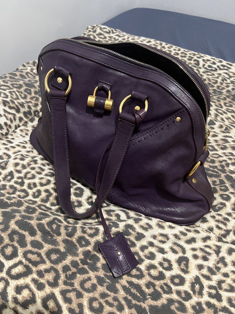 Yves Saint Laurent (YSL) Muse Bag (Category: Luxury Bags & Wallets) located in Quezon City. Submitted by inigodiago (Listing ID 1450585547, Image 1). Description: - Authentic Yves Saint Laurent Muse Two handbag - Deep purple leather with gold hardware - Zipper closure - Interior zippered and slip pockets - Versatile for everyday or special occasions - Shows some signs of wear, but plenty of life left.