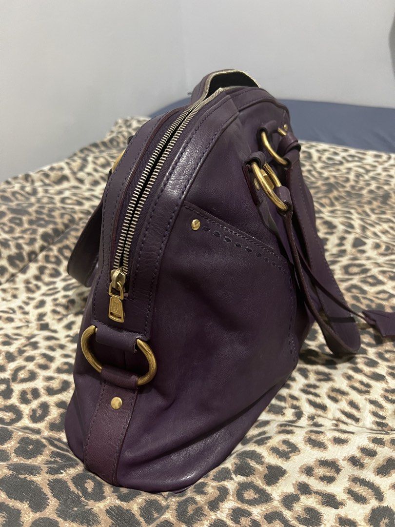 Yves Saint Laurent (YSL) Muse Bag (Category: Luxury Bags & Wallets) located in Quezon City. Submitted by inigodiago (Listing ID 1450585547, Image 2). Description: - Authentic Yves Saint Laurent Muse Two handbag - Deep purple leather with gold hardware - Zipper closure - Interior zippered and slip pockets - Versatile for everyday or special occasions - Shows some signs of wear, but plenty of life left.