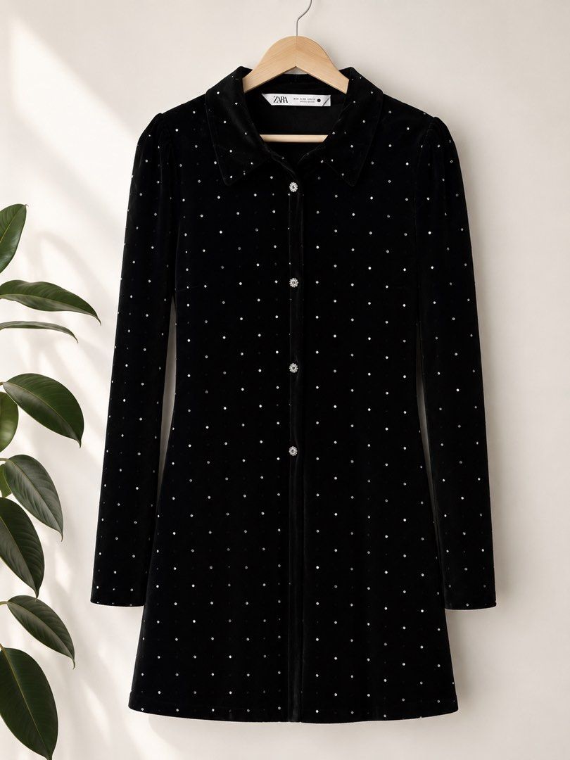Zara Black Dress with Gems (Category: Dresses) located in Manila. Submitted by theopal (Listing ID 1450554319, Image 1). Description: Brand: ZARA * Color: Classic Black * Soft velvet fabric with an elegant finish * Long sleeves * Classic collared neckline * Front button closure with embellished buttons * Mini dress length * All-over crystal/rhinestone embellishments * Relaxed yet flattering silhouette * Ideal for parties, dinners, holiday celebra