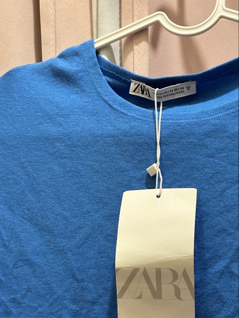 Zara Blue Cropped T-shirt (Category: Shirts) located in Manila. Submitted by jemmmandes (Listing ID 1450720925, Image 3). Description: - Brand: Zara - Style: Cropped T-shirt - perfect for petite - stretchy - Bust: 25 to 28 inches.