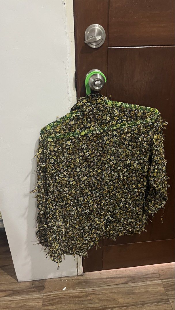 Zara Floral Sheer Button-Up Shirt (Category: Shirts) located in Pasig City. Submitted by kakerts (Listing ID 1450620245, Image 2). Description: - Zara sheer button-up shirt - Black base with yellow and white floral print - Long sleeves with fringe detailing on cuffs and hem - Button closure down the front - Lightweight and flowy material.
