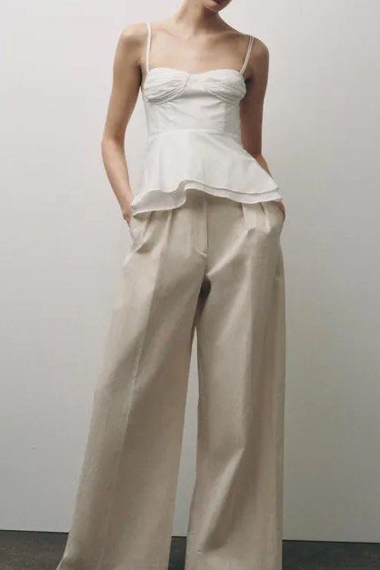 Zara White bustier peplum top (Category: Sleeveless) located in Manila. Submitted by thriftbin (Listing ID 1450574818, Image 2). Description: AVAILABLE srp 2595, selling for 950 viral zara top - sweetheart neckline - peplum hem - tie straps - cotton fabric ACTUAL pics posted, NO when worn 📌only dm if sure buyer loc bulacan ship via j&t.