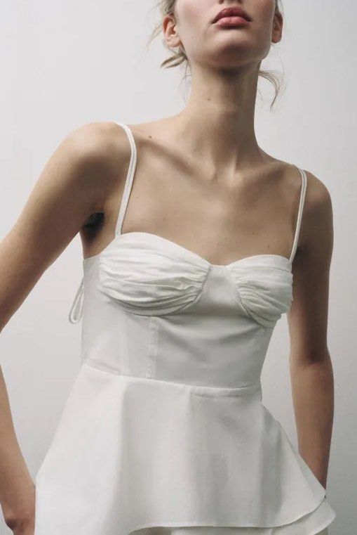 Zara White bustier peplum top (Category: Sleeveless) located in Manila. Submitted by thriftbin (Listing ID 1450574818, Image 1). Description: AVAILABLE srp 2595, selling for 950 viral zara top - sweetheart neckline - peplum hem - tie straps - cotton fabric ACTUAL pics posted, NO when worn 📌only dm if sure buyer loc bulacan ship via j&t.