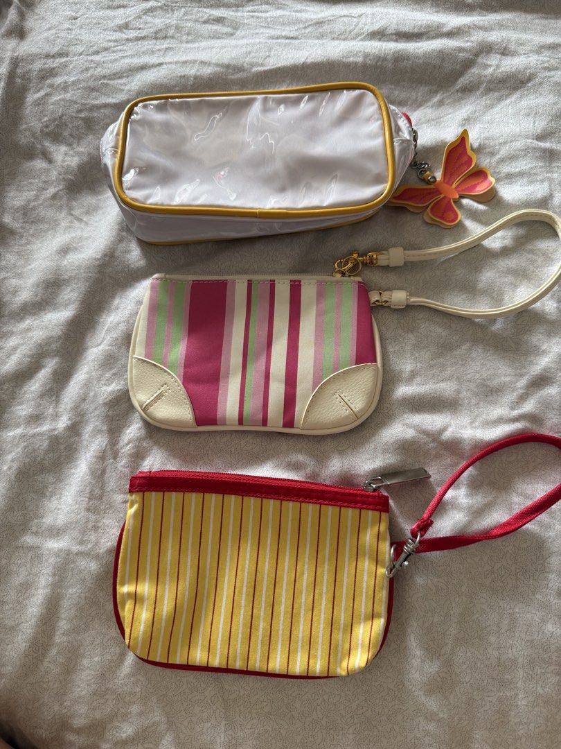 3x Cosmetic Pouches for take only (Category: Purses & Pouches) located in Manila. Submitted by kaiiishop (Listing ID 1447127630, Image 1). Description: White long pouch - Clinique Yellow stripe pouch - Tommy Hilfiger Pink white stripe pouch -Estee Lauder ‼️ FOR TAKE ALL ONLY .