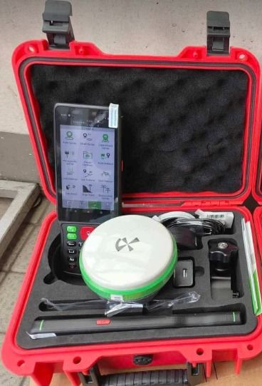 Alpha 4I RTK GNSS (Category: Construction & Building Materials) located in Caloocan City. Submitted by gelkhar071 (Listing ID 1447162719, Image 2). Description: - Brand: Alpha - Model: 4I RTK GNSS - Type: High-precision GNSS receiver - Condition: Excellent, looks new - Features: Sleek design with white, grey, and green accents. Clear indicator lights and power button. - Includes: Durable red carrying case with foam padding, tablet/controller, cha
