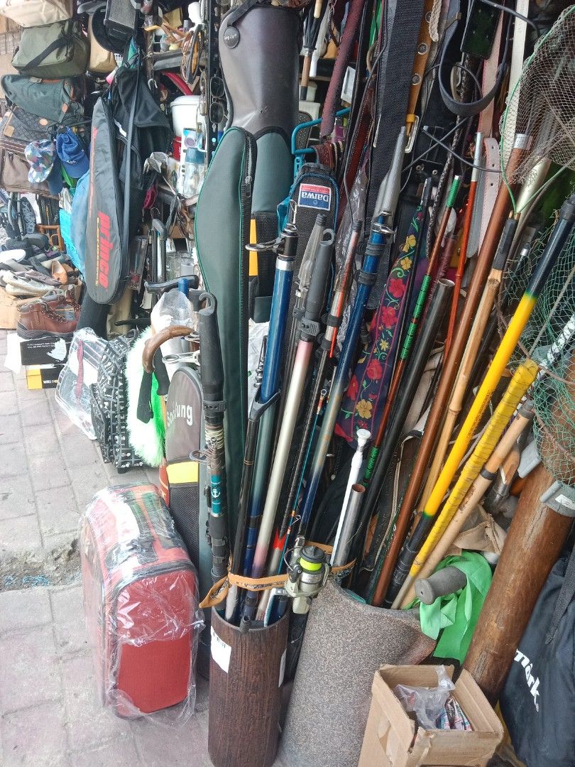 Assorted Fishing Rods and Gear (Category: Fishing) located in Valenzuela. Submitted by japansurplus2020 (Listing ID 1447117618, Image 1). Description: - Assorted fishing rods (various lengths and types) - Some rods include protective cases - Fishing net included - Red tackle bag included - Perfect bundle for any fishing enthusiast.