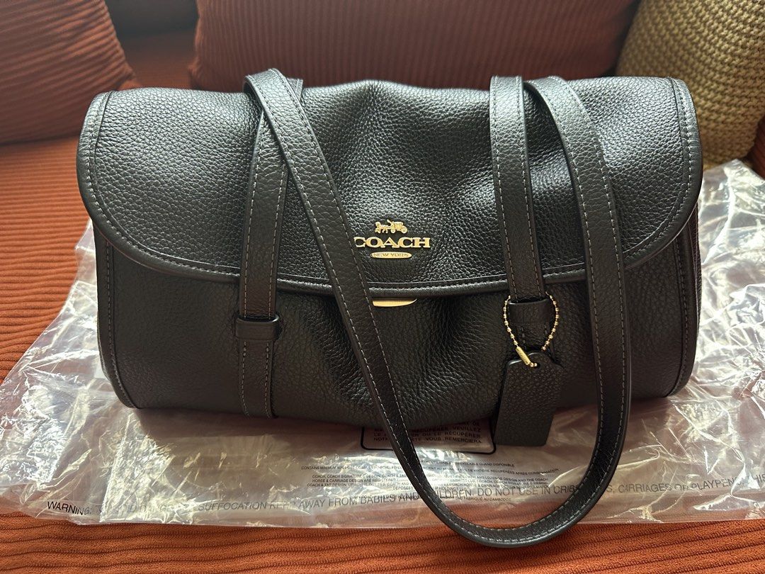 Authentic Coach Bridget flap bag (Category: Bags & Wallets) located in Kuala Lumpur. Submitted by beberm_ling (Listing ID 1447133814, Image 1). Description: Authentic coach bridget bought from usaloveshoppe, can attach purchase receipt through dm Only used for one month ^^ all still looking like new, bag is stor in acrylic box - Brand: Coach - Material: Black pebbled leather - Hardware: Gold-tone - Interior: 1 zip pocket, 1 main compartment - Inc