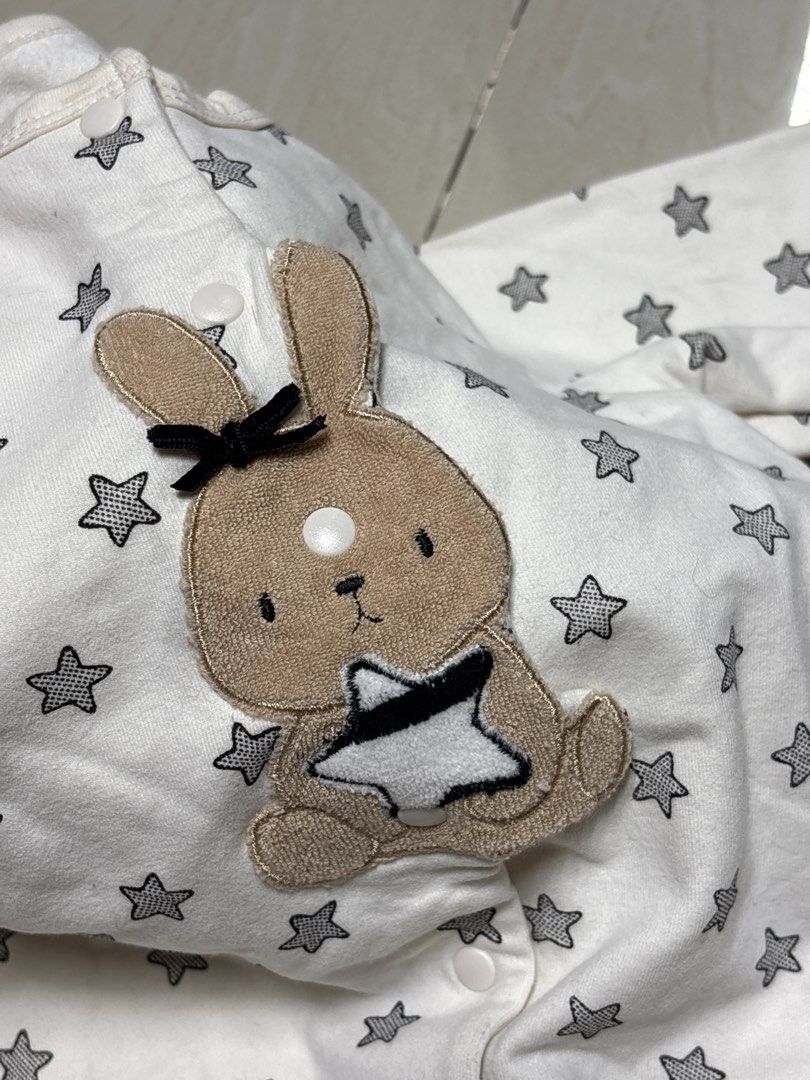 Baby White Star Print Bunny Romper (Category: Babies & Kids Fashion) located in Quezon City. Submitted by sailormooooo (Listing ID 1447279852, Image 3). Description: - Adorable white baby romper - All-over grey star print - Sweet bunny applique with black bow on chest - Long sleeves for warmth - Easy snap closures for quick changes - Made from soft, comfortable fabric.