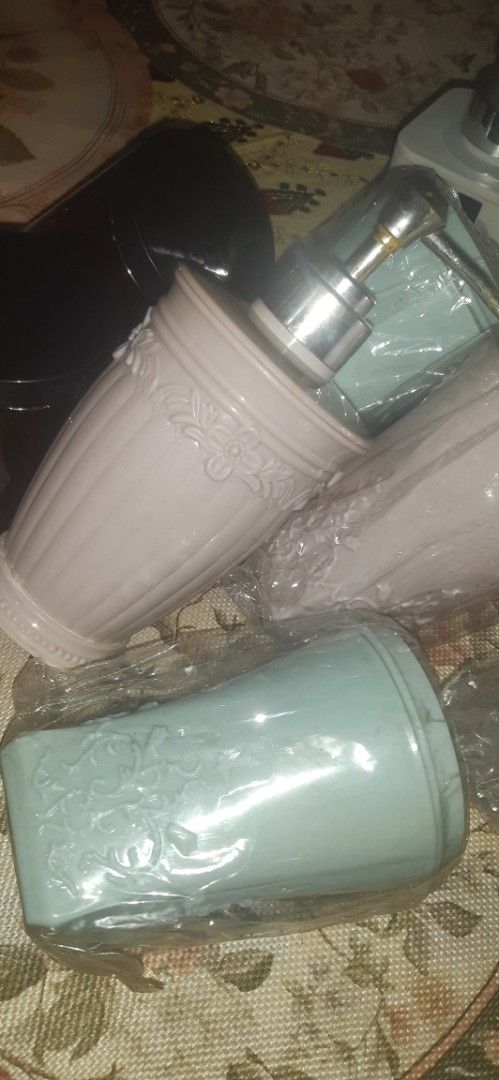 Bathroom Accessories Set - Soap Dispensers and Cups (Category: Bathroom & Kitchen Fixtures) located in Las Pinas. Submitted by declutteri87373 (Listing ID 1447160791, Image 3). Description: - Set includes 2 soap dispensers (1 white, 1 grey). - Comes with multiple cups in pink, light blue, and dark brown. - Some items are still in their original packaging. - Ideal for a bathroom makeover or setting up a guest bathroom. For sale Take all: 7 amber g