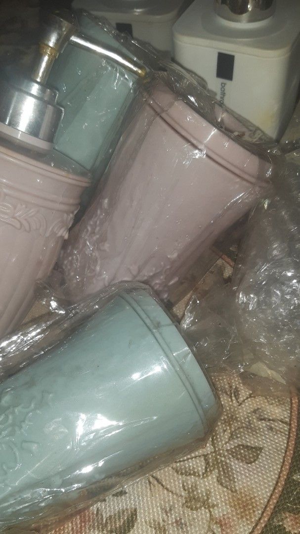 Bathroom Accessories Set - Soap Dispensers and Cups (Category: Bathroom & Kitchen Fixtures) located in Las Pinas. Submitted by declutteri87373 (Listing ID 1447160791, Image 2). Description: - Set includes 2 soap dispensers (1 white, 1 grey). - Comes with multiple cups in pink, light blue, and dark brown. - Some items are still in their original packaging. - Ideal for a bathroom makeover or setting up a guest bathroom. For sale Take all: 7 amber g