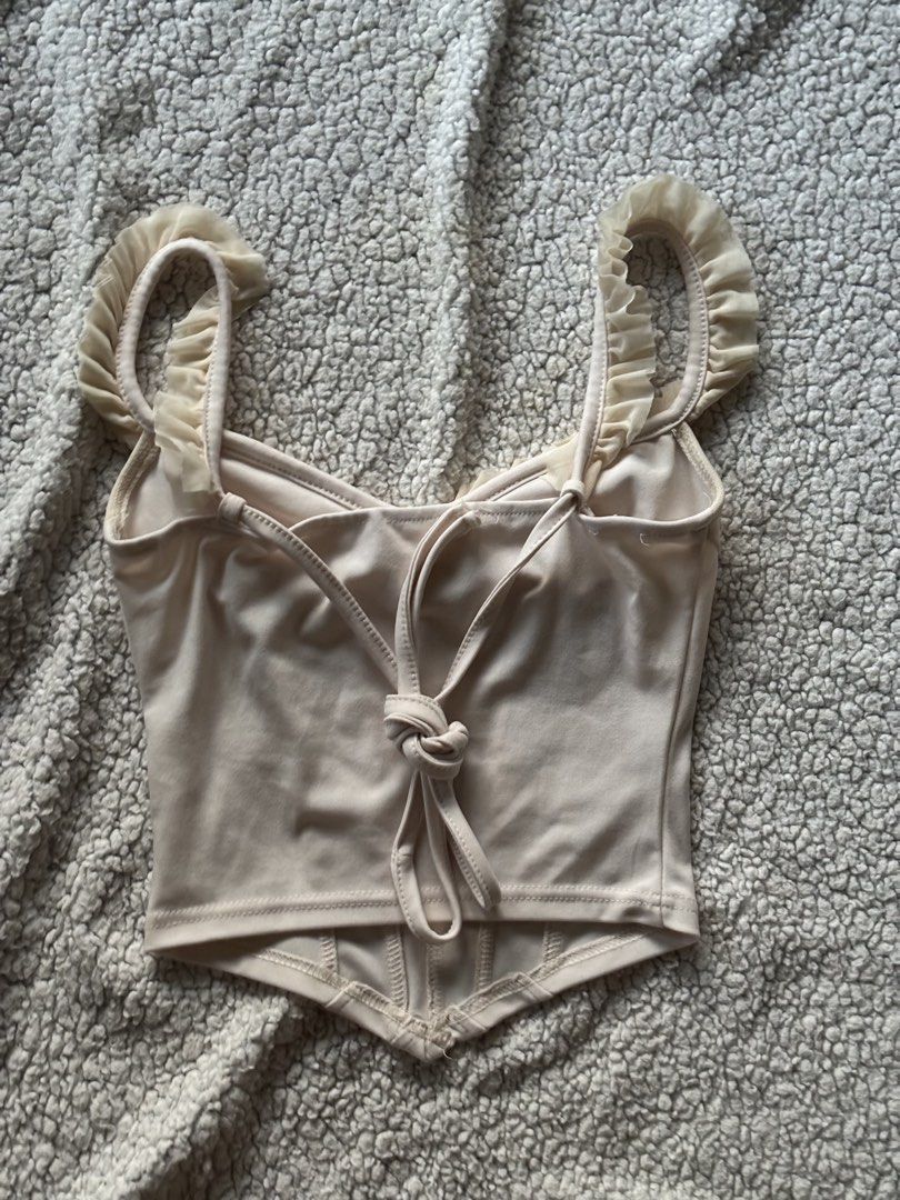 Beige Triangle Top (Category: Blouses) located in San Fernando. Submitted by declutterdolly (Listing ID 1447209048, Image 2). Description: Size: XS-M Closet clean-out, hoping these find new homes 📍Pampanga.