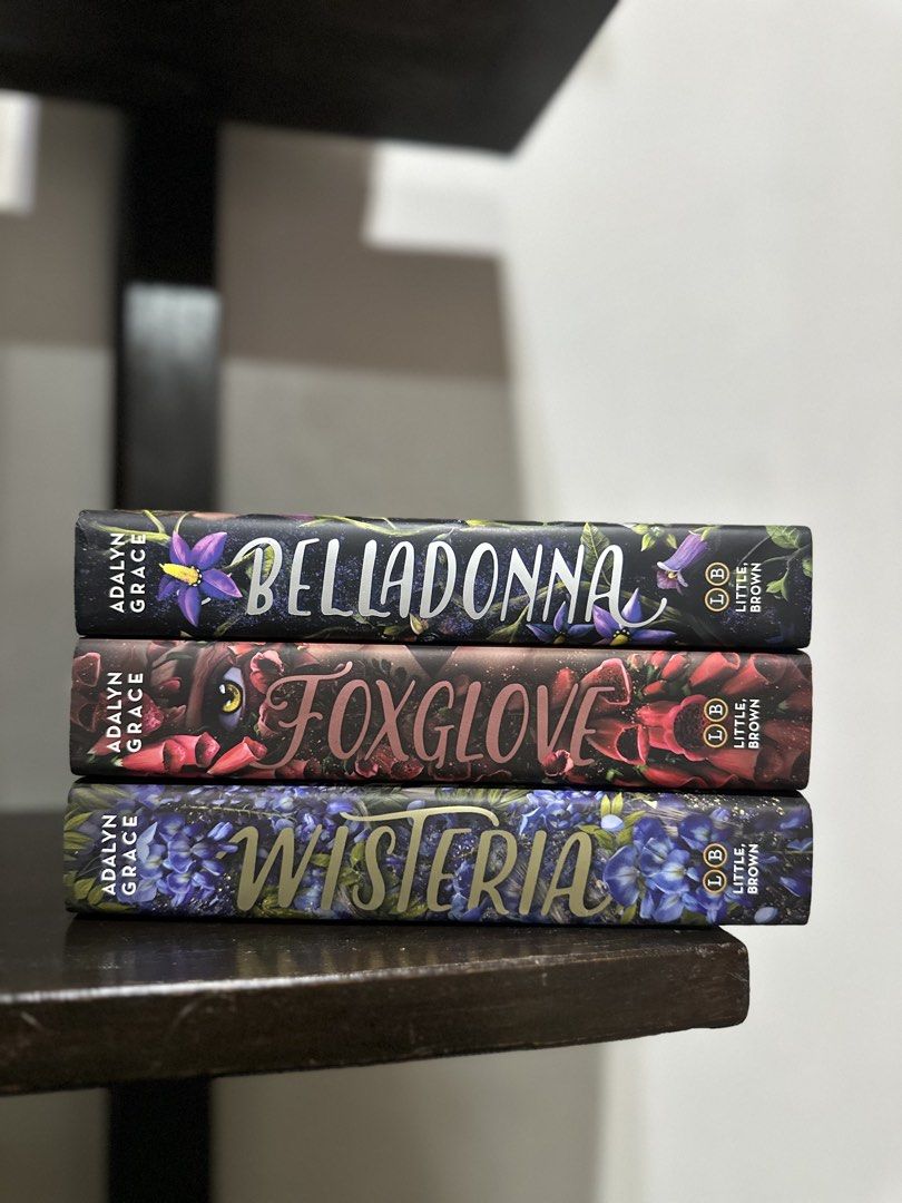 HB Belladonna Series by Adalyn Grace (Category: Storybooks) located in Baguio. Submitted by maryhadalittlebook (Listing ID 1447150385, Image 1). Description: - Includes: Belladonna, Foxglove, and Wisteria - All hardcover editions with hidden covers. - No markings. No spine creases. With minimal foxing and tanning. .