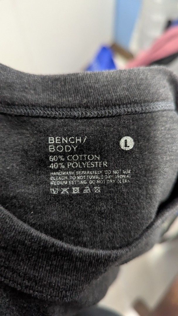 Bench/Body Grey Cotton Polyester T-shirt (Category: Tshirts & Polo Shirts ) located in Marikina City. Submitted by mlektea (Listing ID 1447178647, Image 1). Description: - Brand: Bench/Body - Color: Grey - Size: L on tag pero fits S-M in my opinion - Material: 60% Cotton, 40% Polyester - Style: Basic tee, ideal for everyday wear - Versatility: Easy to pair with any outfit.