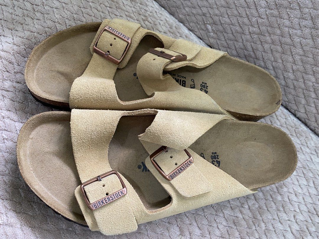 Birkenstock Arizona Suede (Category: Slippers & Slides) located in Pasig City. Submitted by vstn_pr (Listing ID 1447115328, Image 2). Description: - Birkenstock Arizona Sandals - Size: 43 (280mm) - Color: Desert Soil Latte Cream - Made in Germany - Classic double buckle design - Comfortable and supportive cork footbed - Ideal for everyday wear - No Box but brand new and never been used.