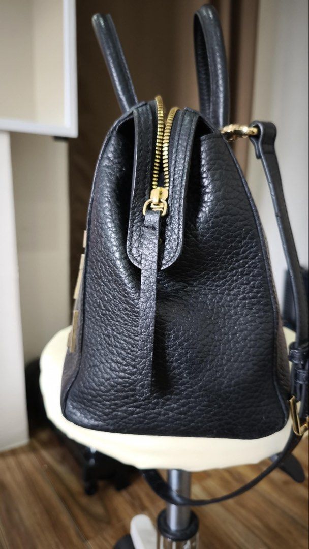 Black Leather Satchel Bag with Gold Hardware (Category: Luxury Bags & Wallets) located in Antipolo. Submitted by waco1313 (Listing ID 1447144157, Image 2). Description: - without strap - Stylish black pebbled leather satchel bag - Elegant gold bar embellishments on the front - Comfortable top handles - Includes a detachable shoulder strap for versatility - Secure zipper closure - All gold-tone hardware - Roomy interior for all your essentials - I