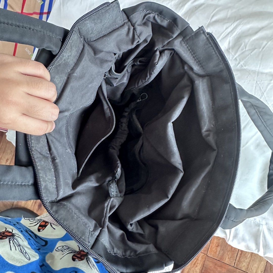BASH Tote Bag Black (Category: Tote Bags) located in Porac. Submitted by declutter.dea (Listing ID 1447110677, Image 2). Description: - Stylish black tote bag - Secure zipper closure - Multiple interior pockets for excellent organization - Comfortable dual handles for carrying - Elegant metal clasp detail - Ideal for everyday use or travel rfs: not used as much anymore.