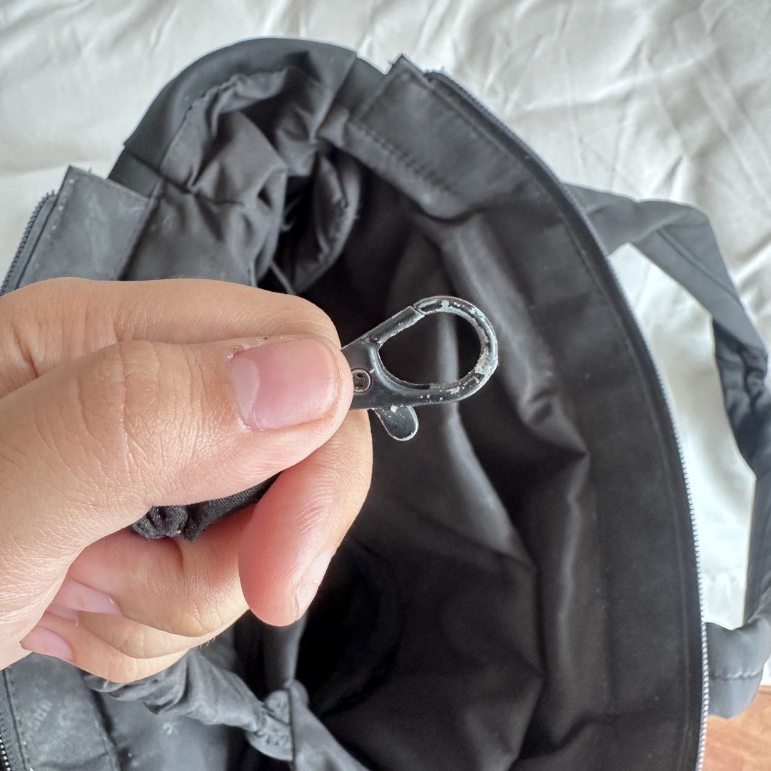 BASH Tote Bag Black (Category: Tote Bags) located in Porac. Submitted by declutter.dea (Listing ID 1447110677, Image 3). Description: - Stylish black tote bag - Secure zipper closure - Multiple interior pockets for excellent organization - Comfortable dual handles for carrying - Elegant metal clasp detail - Ideal for everyday use or travel rfs: not used as much anymore.