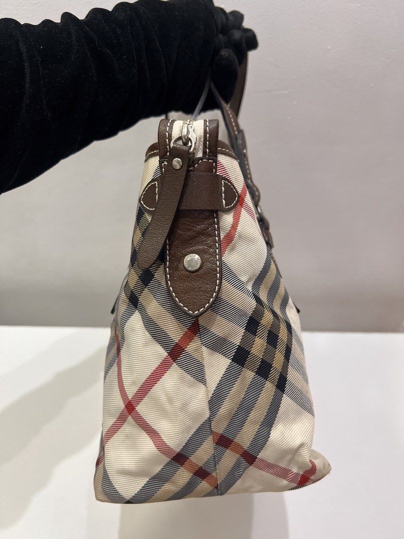 Burberry Blue Label Tote Bag (Category: Luxury Bags & Wallets) located in Cebu City. Submitted by brandedcorner_ph (Listing ID 1447108125, Image 3). Description: Pre-loved ((B))urberry Blue Label Tote Bag 100% Authentic or money back Condition • Excellent condition • No flaws • Minimal sign of usage only Product Details •Color: Multicolor •Hardware: Silver tone •Material: Canvas & leather •Approximate Dimensions in inches: H9 x W16 x D5.5 Color m