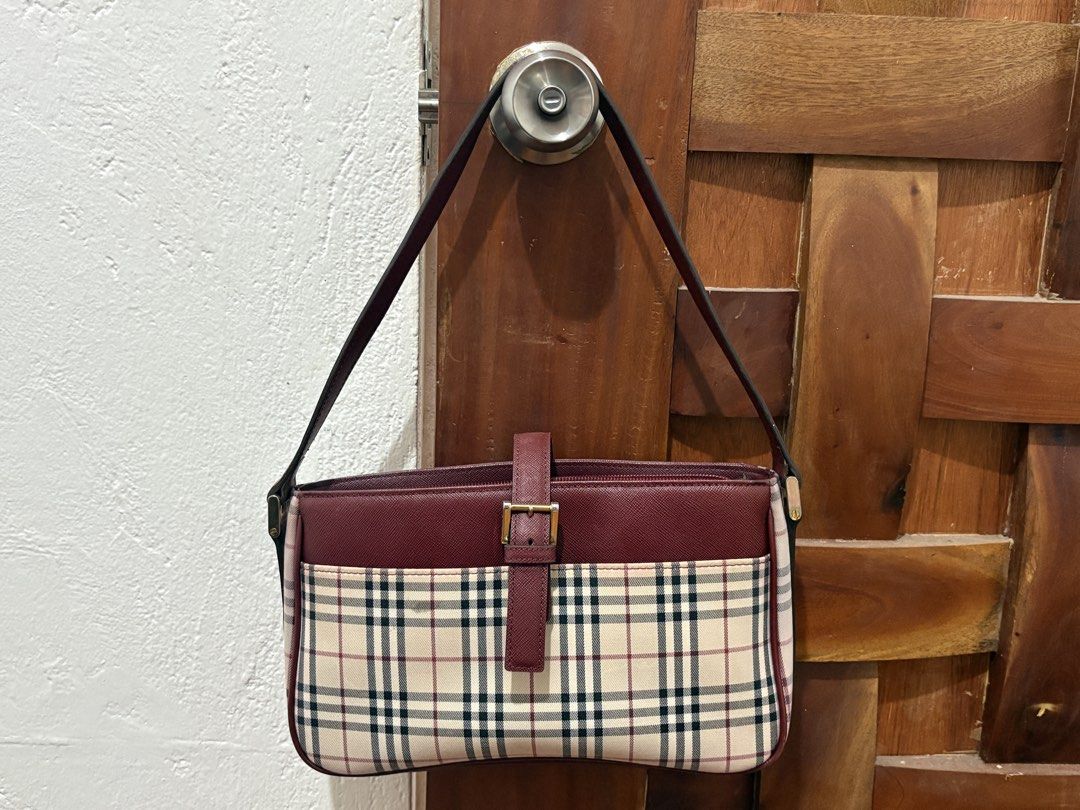 Burberry House Check Canvas Shoulder Bag (Category: Luxury Bags & Wallets) located in Bacolod City. Submitted by matchacham (Listing ID 1447190821, Image 1). Description: - package from japan - red stains can be removed - negotiable location: visayas.