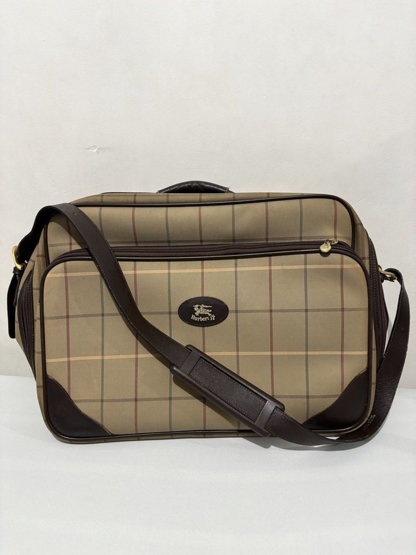 Burberry Nova Check Travel Bag (Category: Luxury Bags & Wallets) located in Muntinlupa City. Submitted by luxurybagprince1 (Listing ID 1447270153, Image 2). Description: - Iconic Burberry Nova Check pattern - Genuine leather trim and handles - Includes a detachable shoulder strap - Ample interior space for essentials - Ideal for weekend trips or as a carry-on luggage.