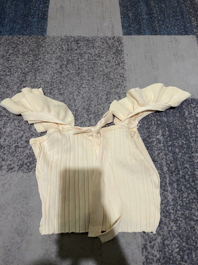Butter yellow Ruffle sleeveless Top (Category: Blouses) located in Binan City. Submitted by chamioezz (Listing ID 1447166617, Image 1). Description: Lightly used, Good Quality, Size: S.