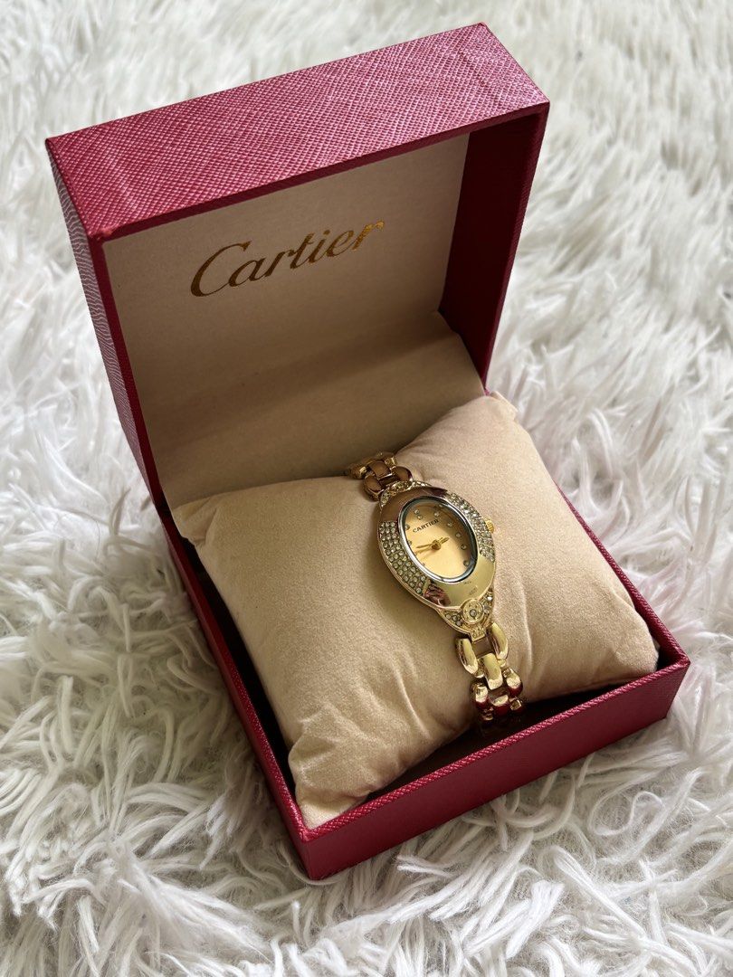 Cartier Gold Watch with Diamonds (Category: Luxury Watches) located in Agdangan. Submitted by jannakim (Listing ID 1447116381, Image 1). Description: - Genuine Cartier watch - Elegant oval face with diamond accents - Comes with original Cartier box - A beautiful statement piece for any occasion - Ideal for gifting - Topgrade.