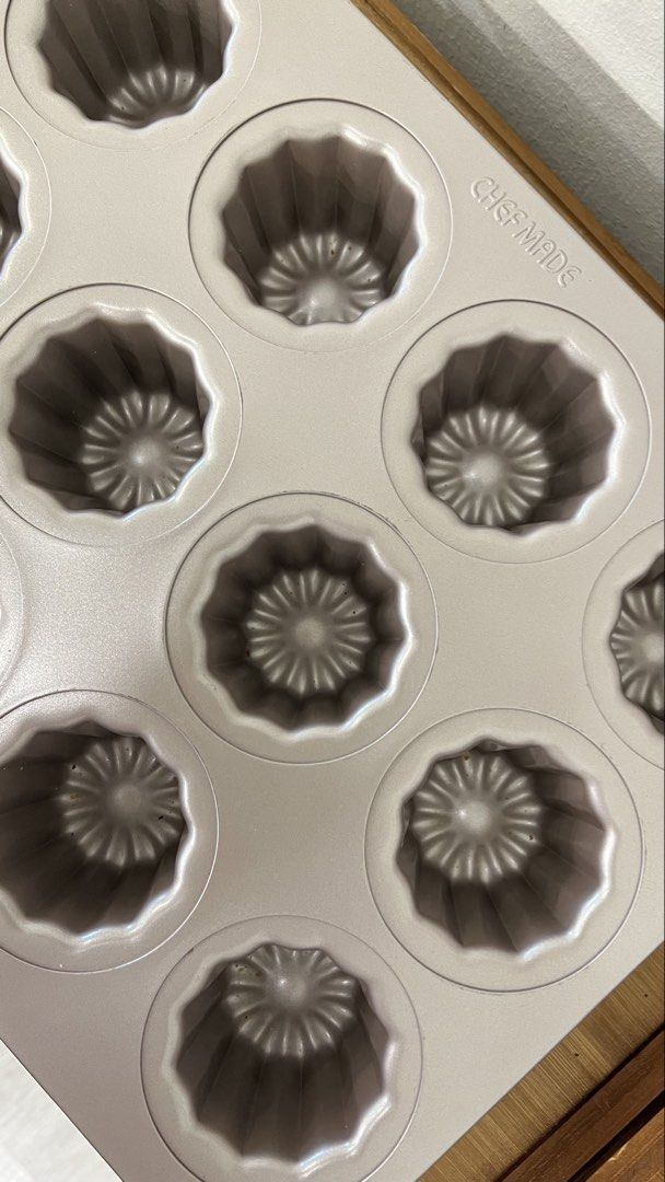 Chef Made 12 Cup Canelé Baking Pan (Category: Bakeware) located in Kuala Lumpur. Submitted by vvtansl (Listing ID 1447163423, Image 2). Description: - Chef Made 12-cup canelé pan - Non-stick surface for easy release - Ideal for authentic French pastries - Simple to clean after baking - Perfect for home bakers - Selling because of excess baking pans.