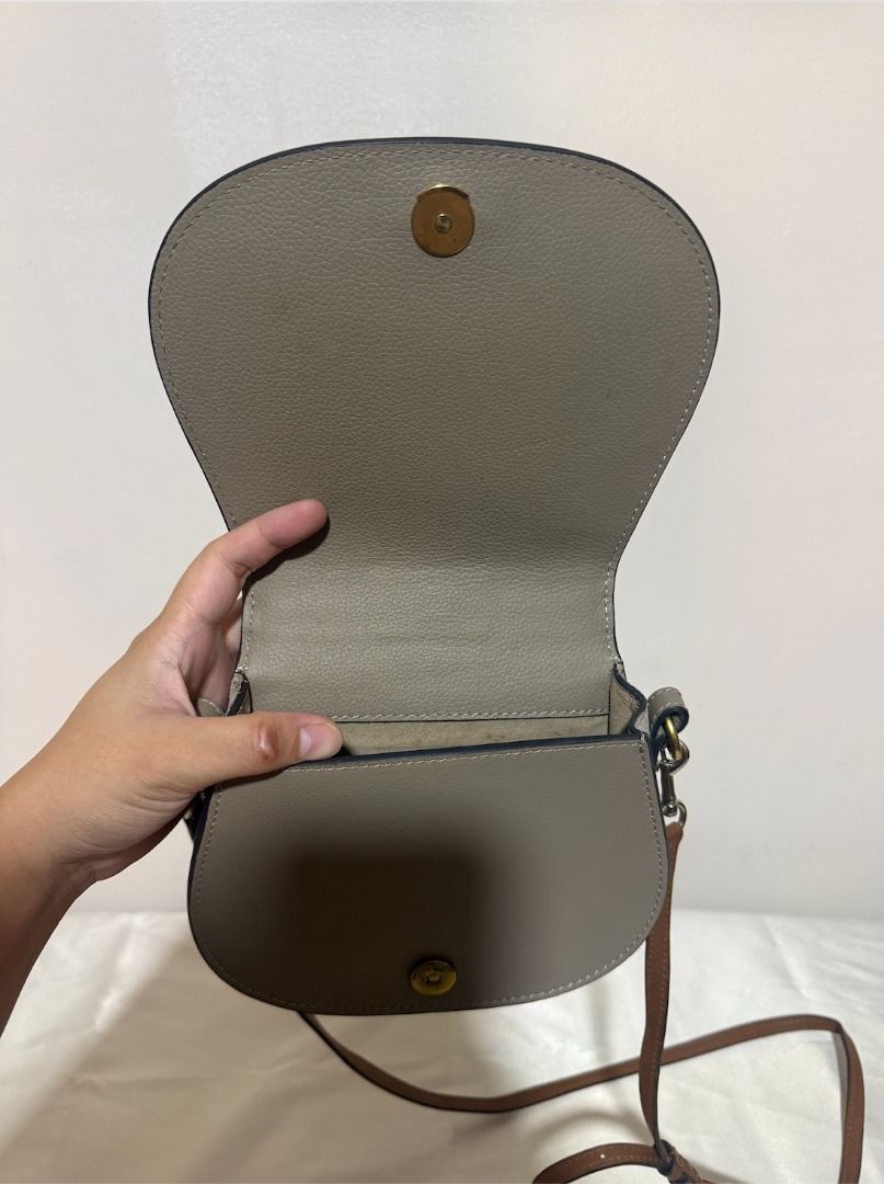 Chloe Nile Bracelet Bag Grey Leather (Category: Luxury Bags & Wallets) located in Imus. Submitted by allycasul (Listing ID 1447172705, Image 3). Description: - Authentic Chloe bag in grey leather - Features the iconic bracelet handle - Can be worn as a crossbody bag - Elegant gold hardware - Secure magnetic snap closure - Interior compartment for essentials - Ideal for both daily use and evening events.