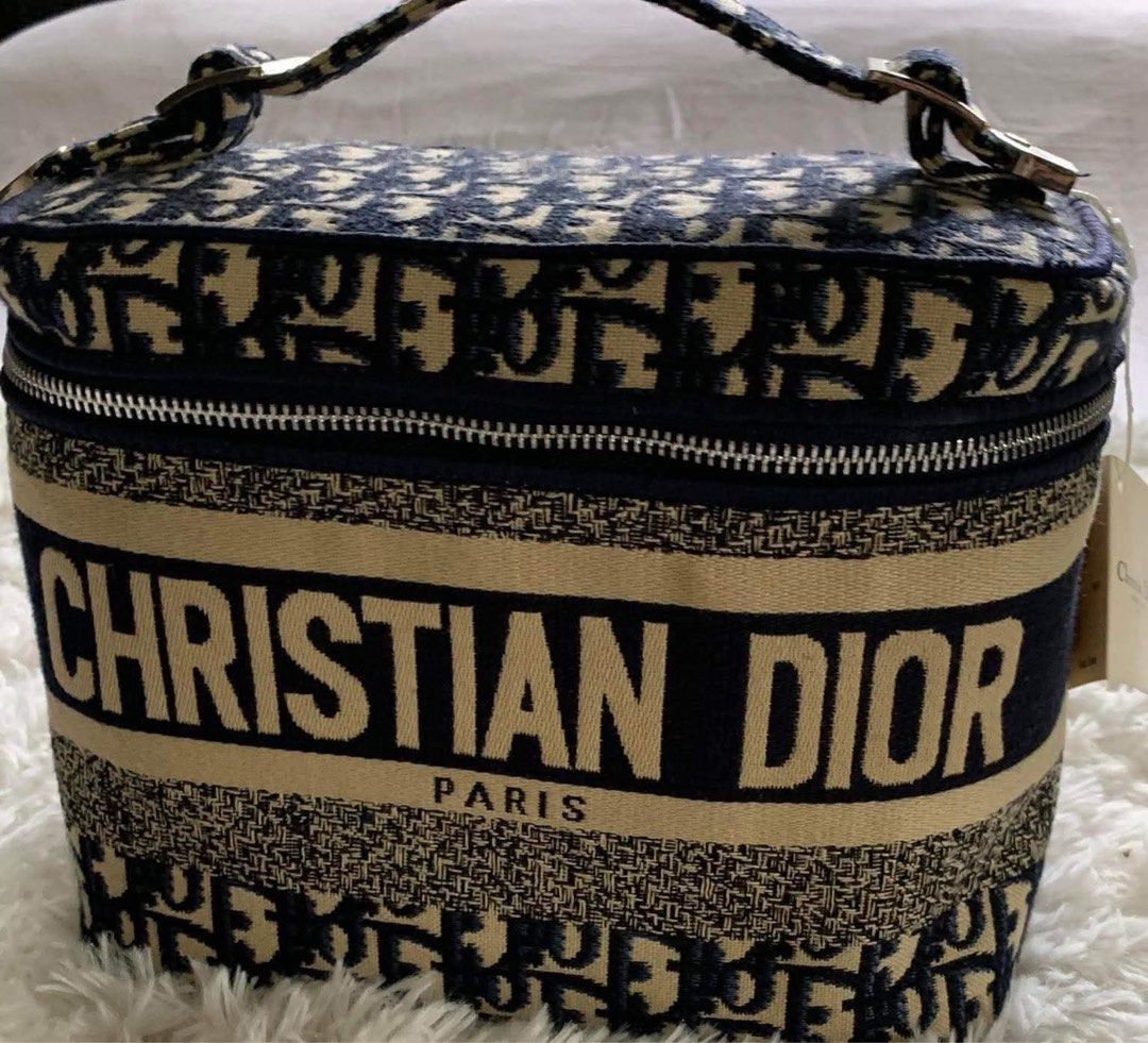 Christian Dior Vanity Case Dior Oblique Canvas (Category: Luxury Bags & Wallets) located in Dasmarinas. Submitted by starseares (Listing ID 1447268514, Image 2). Description: - Authentic Christian Dior vanity case - Iconic Dior Oblique canvas (navy/beige) - Secure zipper closure - Convenient top handle - Ideal for makeup, toiletries, or travel essentials. - Authenticity card, included..