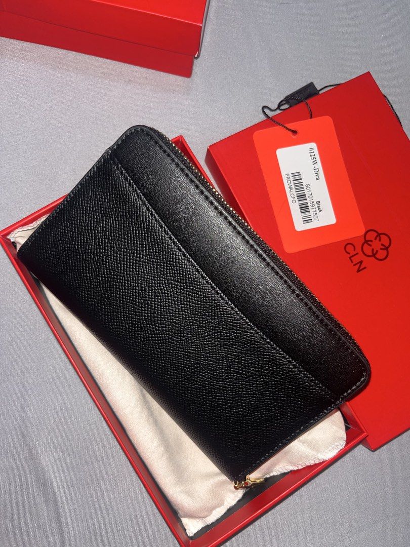CLN DIVA Black Leather Zip Around Wallet (Category: Wallets & Card holders) located in Manila. Submitted by lvefsh (Listing ID 1447261540, Image 2). Description: - Brand: CLN - Material: Black Leather - Style: Zip-around wallet - Includes: Original box and dust bag - Features: Embossed CLN logo on front, plenty of card slots and compartments - Ideal for: Everyday use.