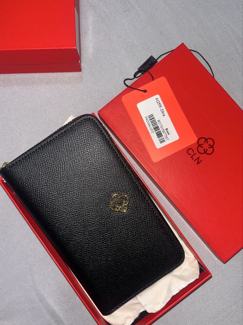 CLN DIVA Black Leather Zip Around Wallet (Category: Wallets & Card holders) located in Manila. Submitted by lvefsh (Listing ID 1447261540, Image 1). Description: - Brand: CLN - Material: Black Leather - Style: Zip-around wallet - Includes: Original box and dust bag - Features: Embossed CLN logo on front, plenty of card slots and compartments - Ideal for: Everyday use.