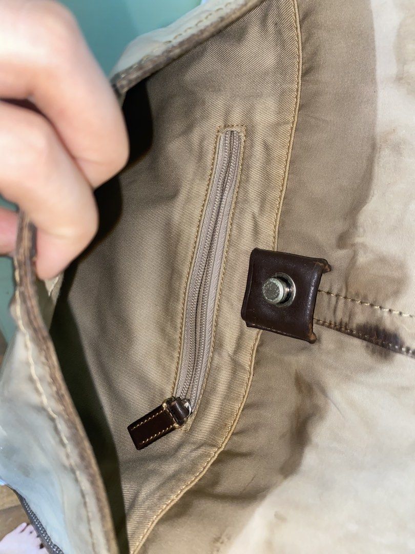 Coach Leatherware Messenger Bag Est. 1941 (Category: Luxury Bags & Wallets) located in Manila. Submitted by nicolezald25729 (Listing ID 1447170497, Image 3). Description: - Classic Coach messenger bag - Tan canvas and dark brown leather - Adjustable strap with buckle closure - Interior zip pocket - Visible stains and wear on canvas - Features classic Coach hardware -Ykk - Ideal for everyday use Need’s special cleaning 🧼 P1000.