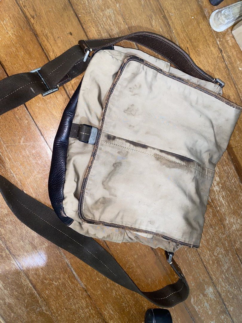 Coach Leatherware Messenger Bag Est. 1941 (Category: Luxury Bags & Wallets) located in Manila. Submitted by nicolezald25729 (Listing ID 1447170497, Image 1). Description: - Classic Coach messenger bag - Tan canvas and dark brown leather - Adjustable strap with buckle closure - Interior zip pocket - Visible stains and wear on canvas - Features classic Coach hardware -Ykk - Ideal for everyday use Need’s special cleaning 🧼 P1000.